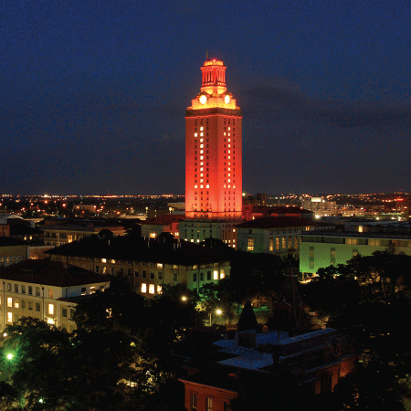 University of Texas tower lit in orange at night