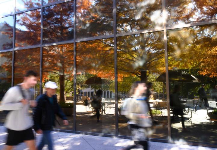 Fall color McCombs students walking blurred