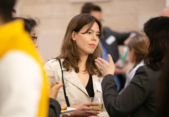 Event attendees network at a reception
