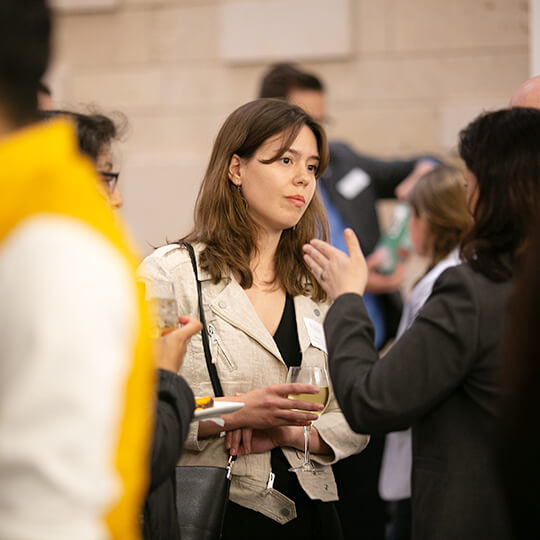 Event attendees network at a reception