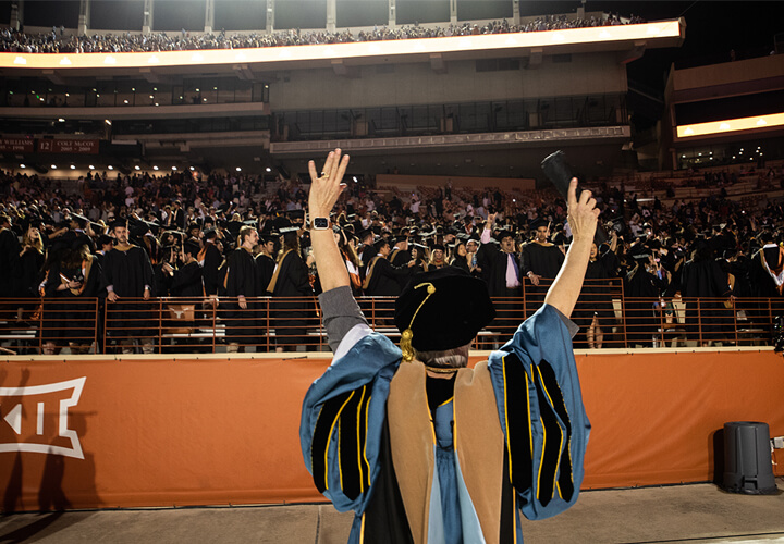 Lillian Mills waves to commencement crowd